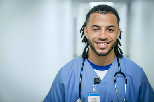 Portrait of smiling mixed race nurse