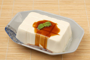 Tofu with  soya sauce on a plate