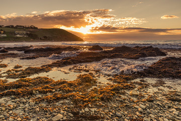 Colourful sunset at the beach with pebbles in Myponga Beach South Australia
