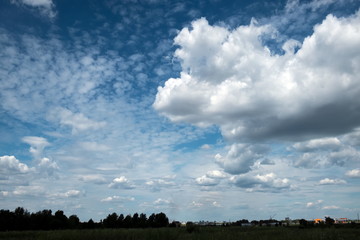 white clouds against the background of the blue sky
