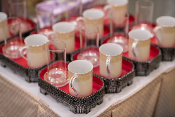 Set of Coffee cup and glass on tray. Prepare for service to monk in Thai culture. Thai wedding ceremony