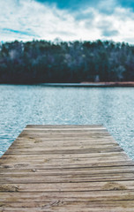Fototapeta premium Wooden Pier Leading to Crystal Clear Lake