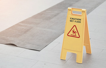 Caution wet floor place on the floor after raining.