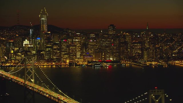 Aerial view of Bay bridge and city at dusk