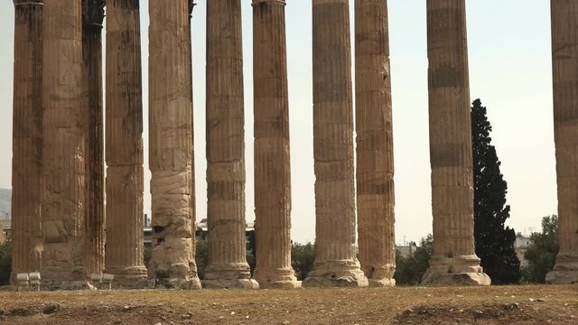 panning shot of the columns of the temple of zeus in athens, greece