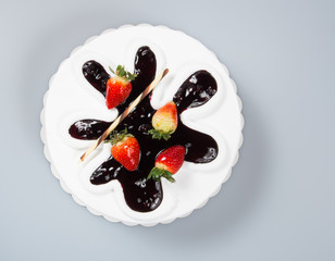 cake or cake with strawberries and chocolate on a background.