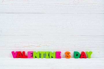 Valentine card with Happy valentine day text and red knitting heart on white wooden background and copy space for add text and picture, love and valentine day concept.