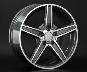 Aluminum metal wheel rim texture. Car alloy wheel, isolated on black background