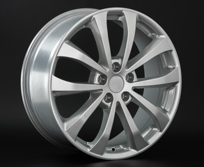 Aluminum metal wheel rim texture. Car alloy wheel, isolated on black background