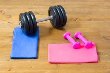sports set of man and woman on a wooden background
