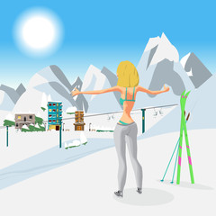 Fototapeta premium Young woman in a bikini in winter on top of a mountain. Girl sun