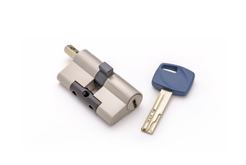 Security lock cylinder with key, for appartment door, isolated on white background