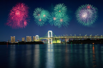 Naklejka premium Tokyo bay city view and tokyo rainbow bridge with beautiful fireworks, Tokyo Japan