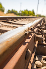 Old rusty metal sleepers on the railway
