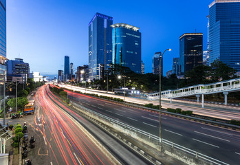 Fototapeta na wymiar Traffic light trails in Jakarta business district in Indonesia capital city.