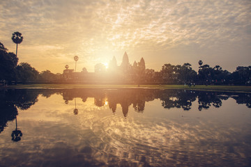 Naklejka premium The beautiful sunrise over Angkor Wat the largest religion temple in the world located in Siem Reap, Cambodia.