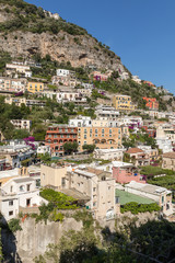 Fototapeta premium Colourful Positano, the jewel of the Amalfi Coast, with its multicoloured homes and buildings perched on a large hill overlooking the sea. Italy