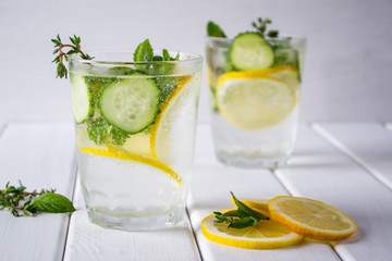 Refreshing  cucumber  cocktail, lemonade, detox water  in a glasses on a white background. Summer drink.
