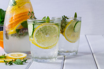 Fruit and herb infused water. Cold refreshing vitamin detox water