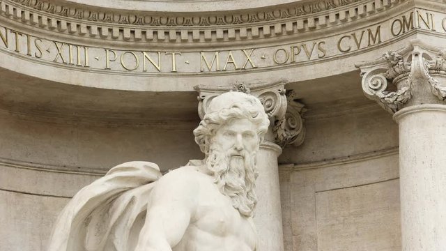 close up zoom in shot of the statue of oceanus at trevi fountain in rome, italy