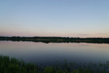 sunset over a lake in forest