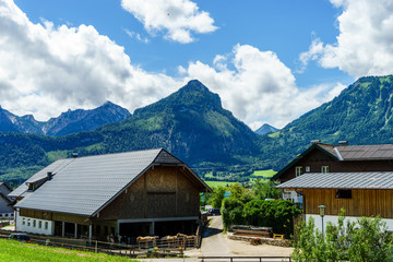 Fototapeta na wymiar View on austrian alps and traditional buildings