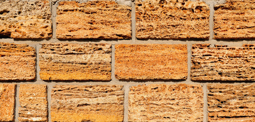 Detail of the house wall. Background made of cut shell rock