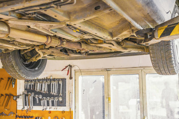 Underside of a car.Car ready for repair service.

