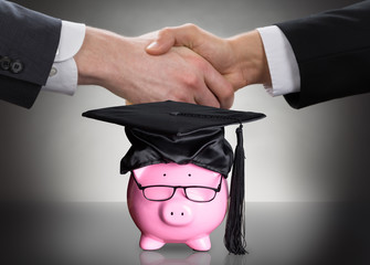 Piggy Bank With Black Graduation Hat And Eyeglasses