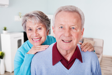 Senior Couple Enjoying Piggyback Ride