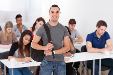 Confident Male Student Carrying Backpack
