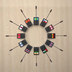 microphones with flags of different countries around