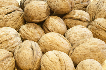 Nuts. Walnut market. Background of walnuts Fresh walnuts. Walnut background scattered pile of walnuts.