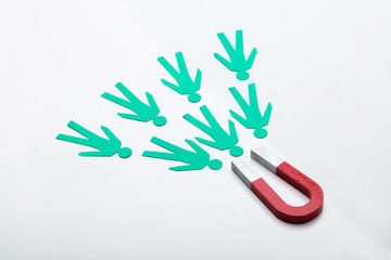 Red Horseshoe Magnet Attracting Paper Cut Out