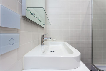 Close white door with metallic handle.