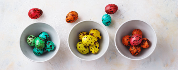 Naklejka na ściany i meble Colored easter eggs on a light background