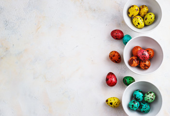 Colored easter eggs on a light background,place for text