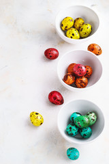 Colored easter eggs on a light background,place for text