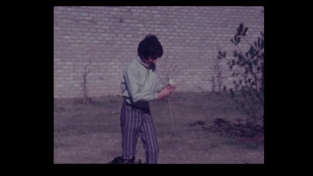 1970 12 year old boy flies kite