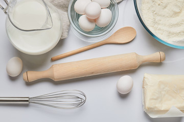top view of eggs and rolling pin on table