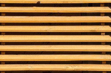 A fence made of vertical wood planks