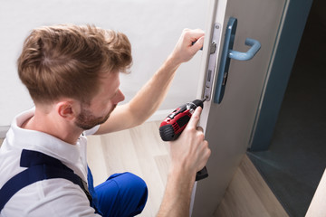 Young Carpenter Install Door Lock