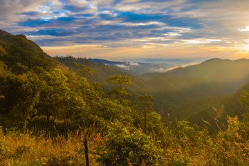 Photo landscape and sunset.The Sunset on the mountains. High  Mountain in chaingrai  province Thailand.