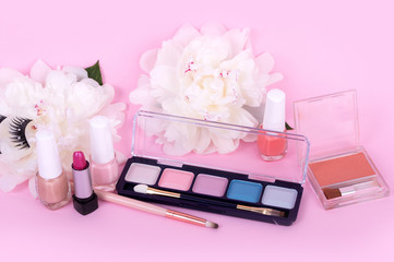 Obraz na płótnie Canvas Female cosmetics on a pink background