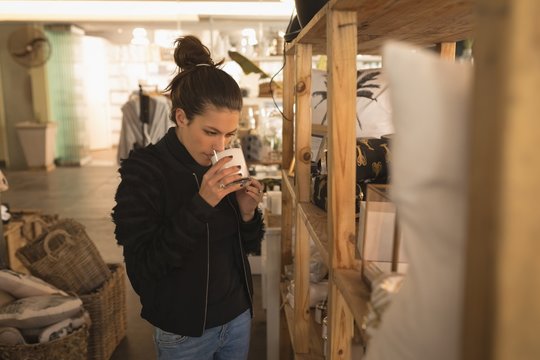 Woman drinking milk in coffee shop