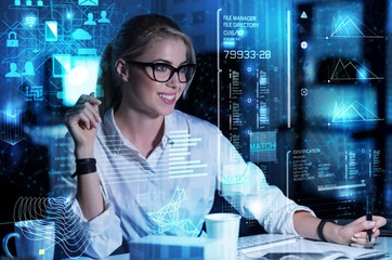 Emotional woman. Smart enthusiastic smiling programmer feeling good while looking at the screen of...