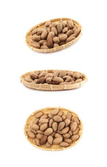 Wicker basket of pecan nuts isolated