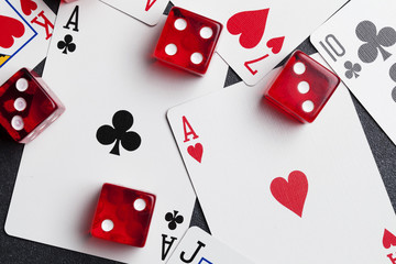 Ace playing cards with red dice. Casino betting and gambling concept