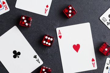 Ace playing cards with red dice. Casino betting and gambling concept