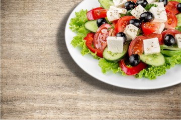 Salad with fresh vegetables on plate